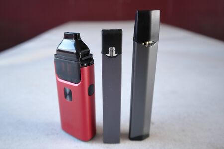 3 different vape pen electronic cigarette devices product shot isolatedの写真素材