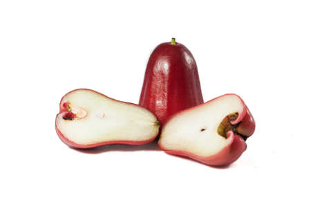 Fresh delicious red rose apples with two pieces cut in haft on isolated white clean background,...