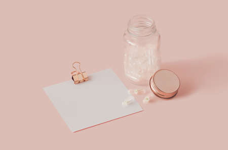 Creative concept with transparent pills with white flowers on pastel pink background. Minimal style creative copy space.の写真素材