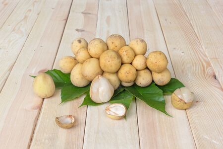 Longkong (Lansium parasiticum),tropic al fruit on wooden backgroundの写真素材