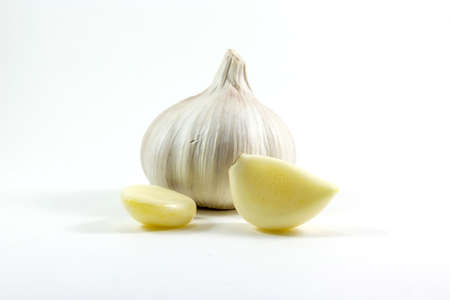 Fresh garlic and Garlic cloves isolated on white backgroundの写真素材