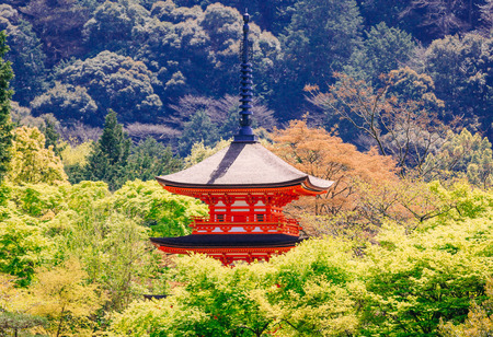 KYOTO, JAPAN - APRIL 13, 2015: The beautiful red pagoda in the Kiyomizu-dera Temple, a famous tourist attraction, in Kyoto on April 13 2015.のeditorial素材