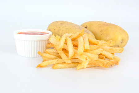 French fries with ketchup and potato on white background.