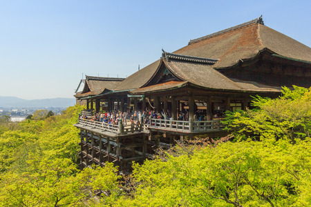 KYOTO, JAPAN - APRIL 18, 2015: Tourists visit Kiyomizu-dera temple. The temple is part of the Historic Monuments of Ancient Kyoto  UNESCO World Heritage site.のeditorial素材