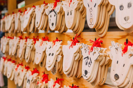 Wooden prayer tablets in Kasuga-taisha shrine in Nara. Wooden prayer tablets in Nara are uniquely...