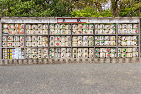 KAMAKURA, JAPAN - APRIL 14, 2014: Stack of Japanese wine (sake) barrels at a shrine on April 14, 2014 in Kamakura, Japan. Japanese donate wine to the temples and shrines as offering for the Gods.のeditorial素材