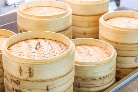 Stack of Chinese Bamboo Steamer, dim sum in bamboo steamer, chinese cuisineの写真素材