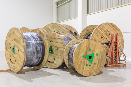 Wooden reel of power conductor cable in the distribution warehouse of factory plantの写真素材
