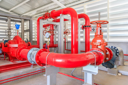 Industrial fire pump station for water sprinkler piping and fire alarm control system. Pipelines, water pump, valves, manometers.