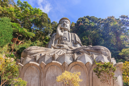 Large stone Buddha statue at Chin Swee Caves Temple in Genting Highlands, Pahang, Malaysiaの写真素材