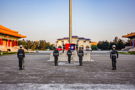 TAIPEI, TAIWAN - APRIL 30, 2017 : Soldier raise the flag in the morning at Chiang Kai-shek memorial hall, a famous monument, tourist attraction and landmark of Taipei, Taiwan.のeditorial素材