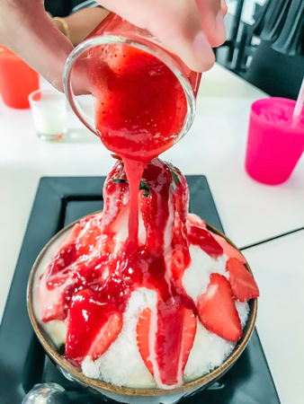 Korean dessert, Bingsoo or Bingsu, Korean shaved ice dessert with strawberry, Strawberry Bingsoo or Bingsu.の写真素材