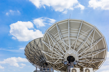 picture of parabolic satellite dish space technology receivers under blue skyの写真素材
