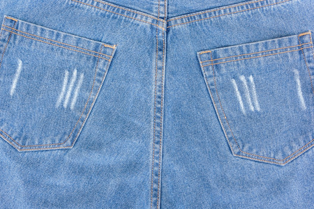 JEANS background, denim jeans background with seam of jeans fashion design. Old grunge vintage denim jean. Stitched texture denim jeans background of fashion jean designの写真素材