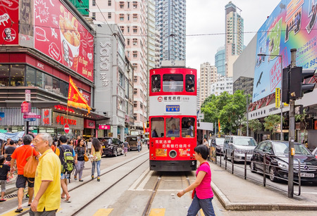 HONG KONG, CHINA - JULY 21, 2013: Unidentified people using city tram in Hong Kong on July 21, 2013. Hong Kong tram is the only in the world run with double deckers and one of the main tourist attractions.のeditorial素材