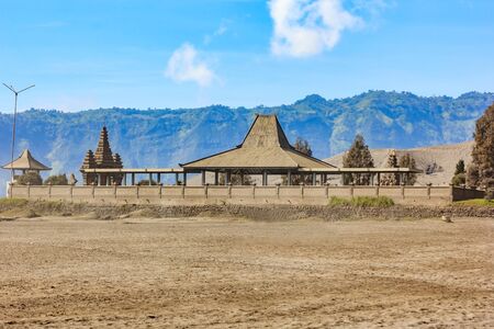 Hindu Temple Pura Luhur Poten at the foot of the active Volcano Bromo early in the morning at the Tengger Semeru National Park in East Java, Indonesia.の写真素材