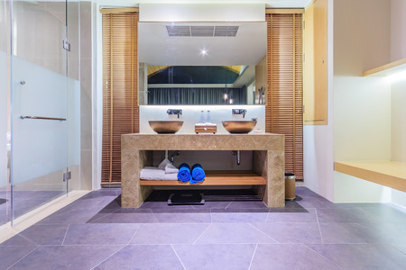 PHUKET, THAILAND - JANUARY 21, 2017: Modern bathroom in luxury apartment with glass walk in shower...