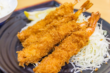 Japanese deep fried shrimp or tonkatsu set with rice on wooden tableの写真素材