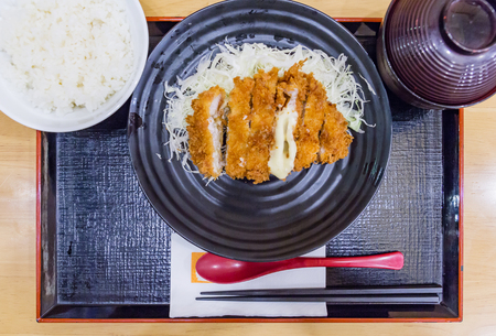 Tonkatsu is a Japanese dish which consists of a breaded, deep-fried pork cutlet./ Deep Fried Pork Loin Cutlet with Salad and Lemon, Japanese Foodの写真素材