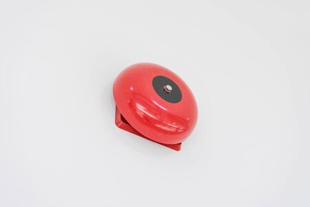 red fire alarm on white wall