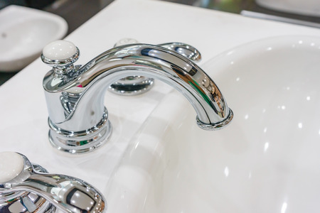 Chrome bathroom faucet. Bathroom water tap. Modern faucet. Bathroom interior. Modern design. Luxury...