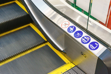 signs on an escalator, warning signs, the escalator at the shopping mallの写真素材
