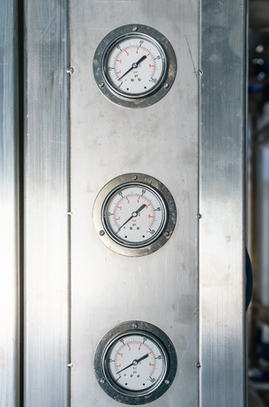 Pressure gauge in the pipeline, measuring water pressure in pipe and valvesの写真素材