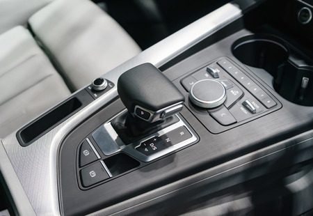 automatic gear stick of a modern car, car interior details