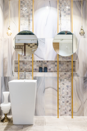 Interior of bathroom with sink basin faucet and mirror. Modern design of bathroomの写真素材