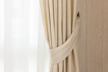 closed up beautiful curtain in daylight cozy room home conceptの写真素材