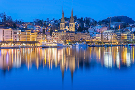 River Reuss with church of Saint Leodegar in Luzern. Luzern is a city in central Switzerland.
