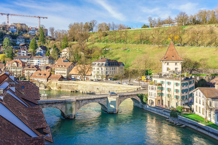 Bern, Switzerland. View of the old city center and Nydeggbrucke bridge over river Aare.