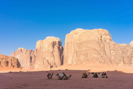Desert landscape with camel. Sand, mountains and a desert on a Wadi Rum desert in Jordanの写真素材