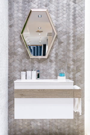 Interior of bathroom with washbasin faucet and white towel. Modern design of bathroom.の写真素材