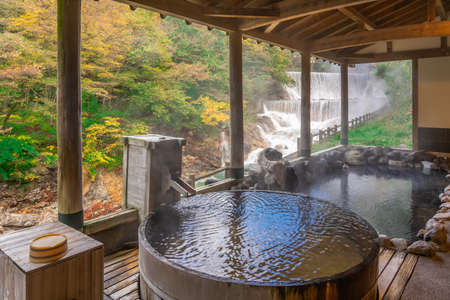 Japanese Hot Springs Onsen Natural Bath Surrounded by red-yellow leaves. In fall leaves fall in Fukushima, Japan.のeditorial素材