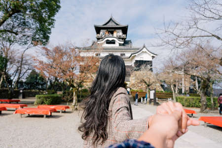 Young woman asia traveller enjoying the view of Inuyama Castle in Inuyama, Aichi Prefecture, Japan. Traveling together. Follow meのeditorial素材