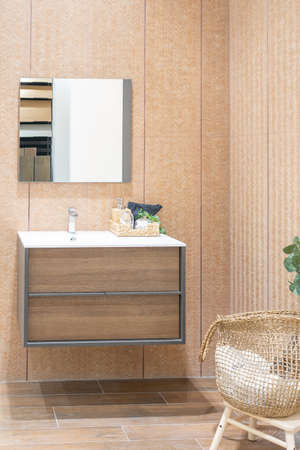 Bathroom interior with white wall, vintage furniture, towels, toilet and sinkの写真素材
