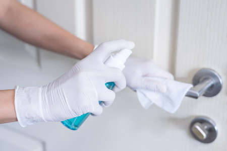Deep cleaning for Covid-19 disease prevention. alcohol,disinfectant spray on Wipes of banister in...