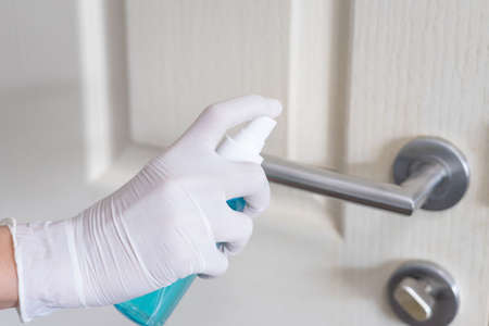 Deep cleaning for Covid-19 disease prevention. alcohol,disinfectant spray on Wipes of banister in home for safety,infection of Covid-19 virus,contamination,germs,bacteria for good hygiene. Concept of heath and safetyの写真素材