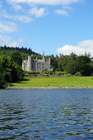 Castlewellan Castle and tourists by Castlewellan Lake. July 2019, Castlewellan, Northern Irelandのeditorial素材
