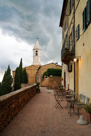 The most popular street in Pienza, Tuscany, Italy called The Street Of Love and view of Pienza Cathedral in the backgroundの写真素材