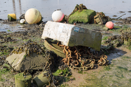 Sea bed junk exposed at low tideの写真素材