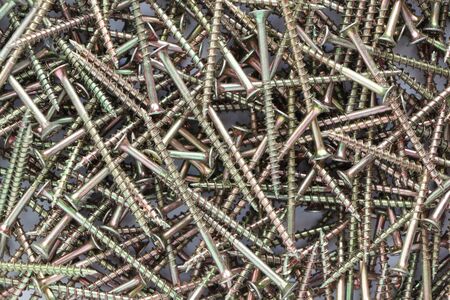 a pile of galvanized screws