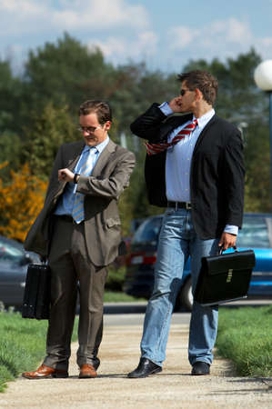 Two young partners are heading up to a meetingの写真素材