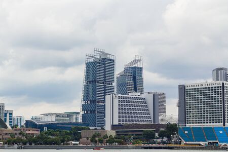 Singapore - December 17, 2016: Modern Building and Mandarin Oriental Hotel located in Marina Bay Area.のeditorial素材