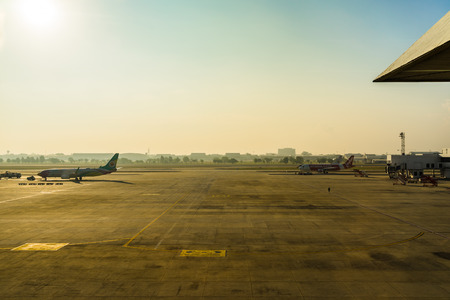 Bangkok, Thailand - March 19, 2017: Don Muang International Airport. Parking Airplanes at airport during boarding operations. They are few planes on a sunny day, with a blue sky.のeditorial素材