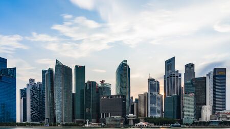 Singapore - March 25, 2017: Singapore Cityscape Financial building with Dramatic Cloud in Marina Bay area Singapore, Urban Duskのeditorial素材