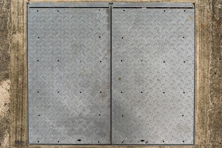 Background of Old metal diamond plate on concrete floor, Steel texture backgroundの写真素材