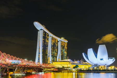 Singapore - August 1, 2017: Night scene of Marina Bay Sands Hotel and The Lotus Shaped ArtScience Museum with illuminated lightingのeditorial素材