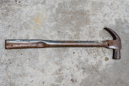 Old tools Iron Hammer on ages cement floor, Old Metal Hammer in vintage backgroundの写真素材